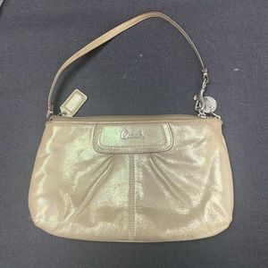 Shoulder purse with gold tone and gold accessories